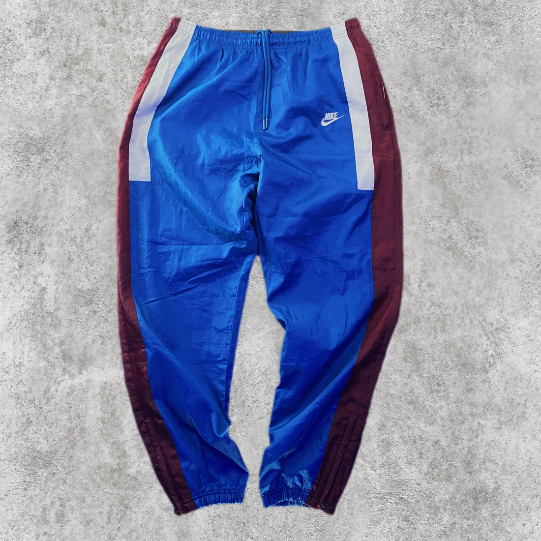 Pantalón Cortavientos Nike Paneles Blanco y Granate Azul