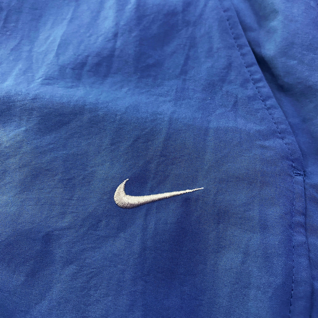 Pantalón Cortavientos Nike Liso Swoosh Bordado Azul