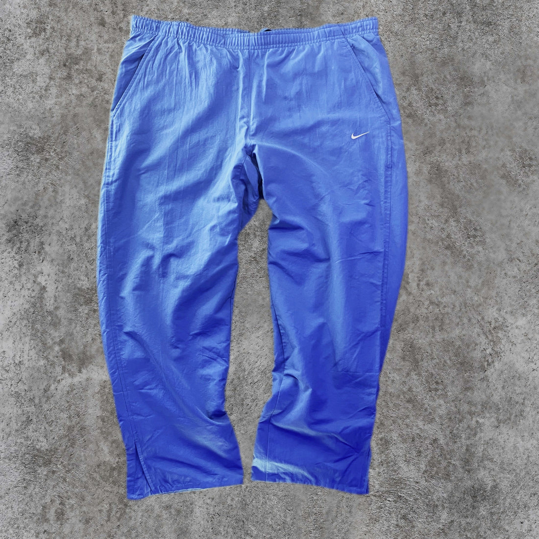Pantalón Cortavientos Nike Liso Swoosh Bordado Azul