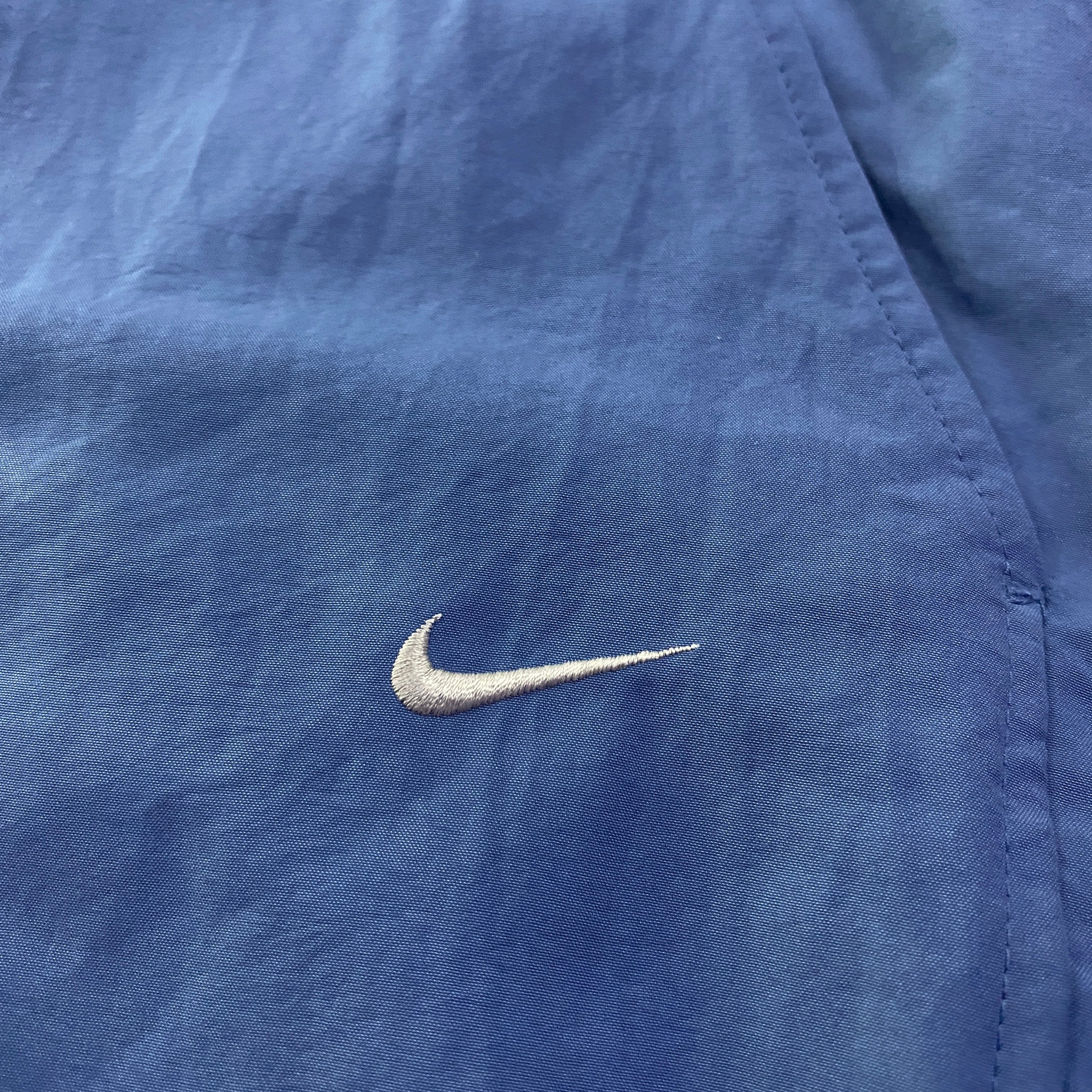 Pantalón Cortavientos Nike Liso Swoosh Bordado Azul