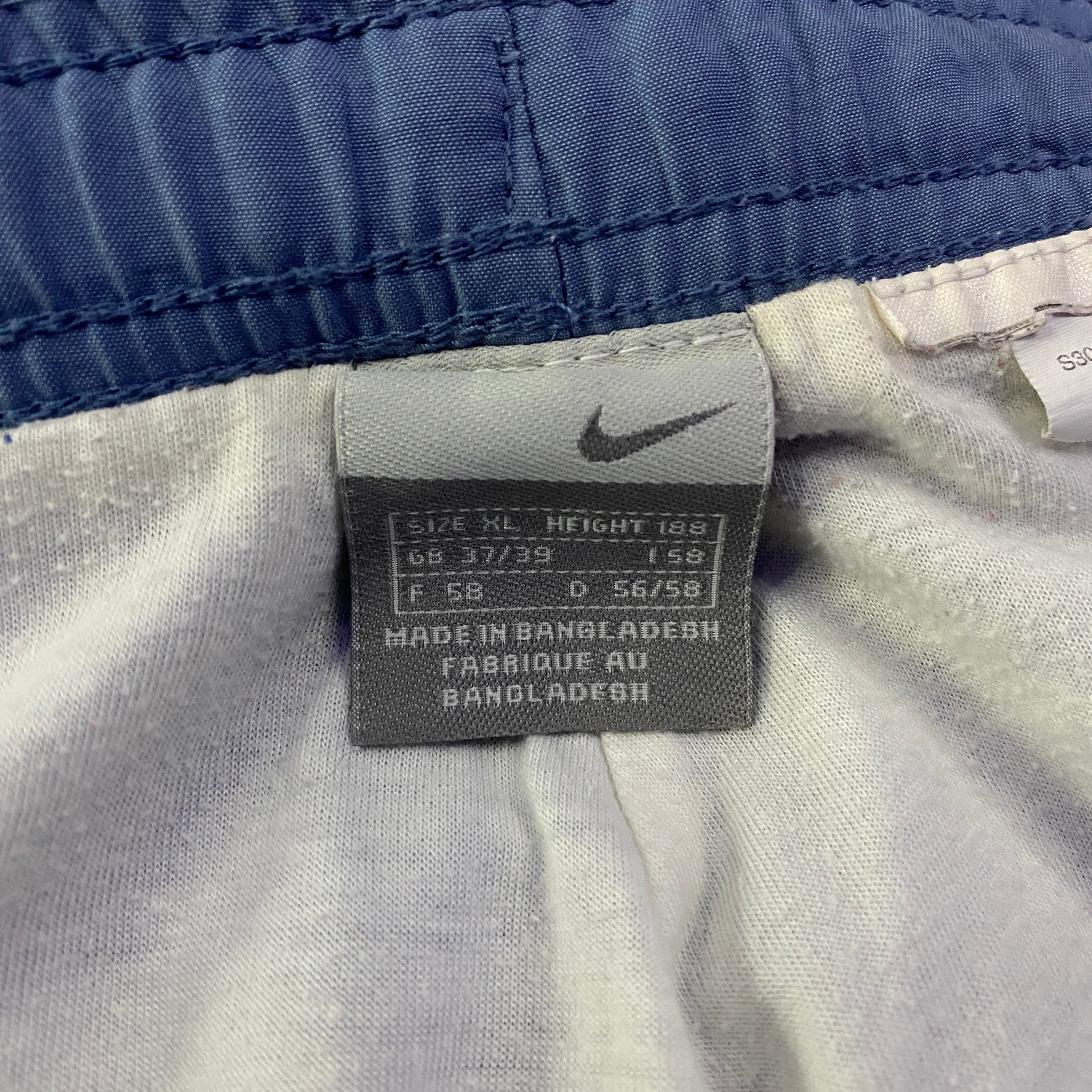 Pantalón Cortavientos Nike Liso Swoosh Bordado Azul