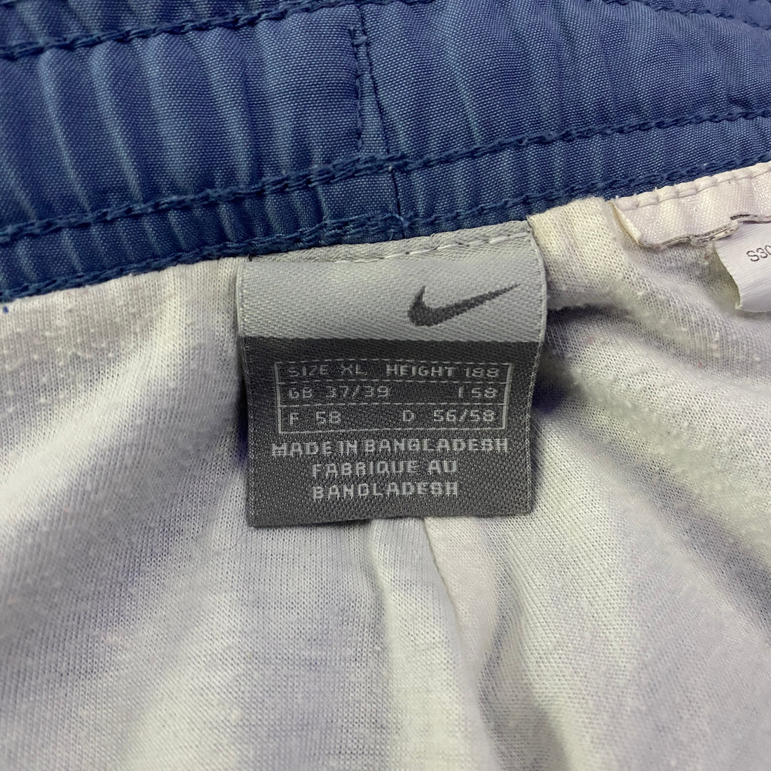 Pantalón Cortavientos Nike Liso Swoosh Bordado Azul